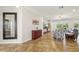 Living room showcases the elegant tile flooring, natural light, and seamless flow to the outdoors at 2803 130Th E Ave, Parrish, FL 34219