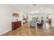 Inviting living room featuring tile flooring, a comfortable gray sofa, and a ceiling fan, creating a relaxing atmosphere at 2803 130Th E Ave, Parrish, FL 34219