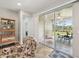 Bright sunroom with sliding glass doors leads to an outdoor patio with beautiful lake views at 2803 130Th E Ave, Parrish, FL 34219