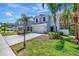Charming two-story home with beautiful landscaping and a well-maintained lawn at 2904 N Ola Ave, Tampa, FL 33602