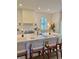 Kitchen island with seating, stainless steel appliances, and a view of the backyard at 2904 N Ola Ave, Tampa, FL 33602