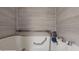 Walk-in bathtub with safety bar, tile surround, and modern fixtures at 3075 Rosery Ne Rd, Largo, FL 33771
