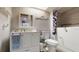 Bathroom featuring walk-in bathtub, white vanity, and neutral color palette at 3075 Rosery Ne Rd, Largo, FL 33771