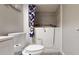 Bathroom featuring a walk-in bathtub, toilet, and vanity with ample storage space at 3075 Rosery Ne Rd, Largo, FL 33771