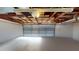 The spacious garage has painted walls and a cement floor at 3075 Rosery Ne Rd, Largo, FL 33771