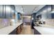 Spacious kitchen features stainless appliances, ample storage, and stylish countertops at 3075 Rosery Ne Rd, Largo, FL 33771