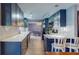 Spacious kitchen with white countertops, updated appliances, and an open layout to the dining area at 3075 Rosery Ne Rd, Largo, FL 33771