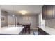 Bright kitchen with dining area, featuring a wooden table and pendant lighting at 3075 Rosery Ne Rd, Largo, FL 33771