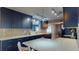 Modern kitchen with custom cabinetry, ample counter space, and contemporary lighting at 3075 Rosery Ne Rd, Largo, FL 33771