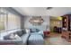 Comfortable living room with plush sectional sofa, stylish decor, and abundant natural light at 3075 Rosery Ne Rd, Largo, FL 33771
