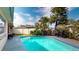 Beautiful pool with lush landscaping, ideal for outdoor entertaining and relaxation at 3075 Rosery Ne Rd, Largo, FL 33771