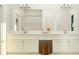Luxurious bathroom featuring a dual vanity, a large mirror, and modern fixtures at 31744 Parkland Bay Way, San Antonio, FL 33576