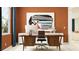 Bright home office features modern desk, chair and storage with large art piece for inspiring workspace at 31793 Griffin Sands Ln, San Antonio, FL 33576