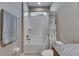 Bathroom features a shower and tub combo and granite countertops at 32628 Harmony Oaks Dr, Wesley Chapel, FL 33545