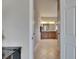 Hallway view of bathroom featuring double vanity, tile floor and walk-in shower at 32628 Harmony Oaks Dr, Wesley Chapel, FL 33545