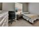 Bedroom featuring neutral walls, carpet floors and exterior view at 32628 Harmony Oaks Dr, Wesley Chapel, FL 33545