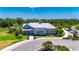 A clubhouse complete with landscaping, sidewalks, and parking area at 32628 Harmony Oaks Dr, Wesley Chapel, FL 33545