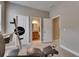 Bright exercise room with weight bench and bathroom accessible through the doorway at 32628 Harmony Oaks Dr, Wesley Chapel, FL 33545