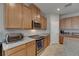 Close up of a kitchen with stainless steel appliances and granite countertops at 32628 Harmony Oaks Dr, Wesley Chapel, FL 33545