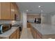 Spacious kitchen features stainless steel appliances, granite countertops, and ample cabinet space at 32628 Harmony Oaks Dr, Wesley Chapel, FL 33545