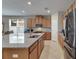 Spacious kitchen features stainless steel appliances, granite countertops, and ample cabinet space at 32628 Harmony Oaks Dr, Wesley Chapel, FL 33545