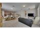 Spacious living room features a dining area, tile floors, and natural light at 32628 Harmony Oaks Dr, Wesley Chapel, FL 33545
