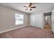 Bright bedroom with a ceiling fan and a double-door closet at 3439 Northridge Dr, Clearwater, FL 33761