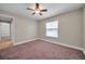 Bedroom with neutral walls, plush carpet, and a ceiling fan at 3439 Northridge Dr, Clearwater, FL 33761