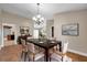 Elegant dining room featuring modern decor, wood floors and ample seating at 3439 Northridge Dr, Clearwater, FL 33761
