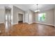 Bright dining room with hardwood floors, natural light and chandelier at 3439 Northridge Dr, Clearwater, FL 33761