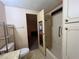 Bathroom featuring a toilet, vanity, tile floor, and shower-tub combo at 35804 Brisa Dr, Zephyrhills, FL 33541