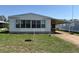 Charming single-story home with a covered carport and well-maintained lawn at 35804 Brisa Dr, Zephyrhills, FL 33541