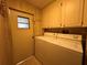 Laundry room featuring a washer, dryer, window and cabinets at 35804 Brisa Dr, Zephyrhills, FL 33541