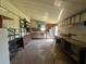 Spacious workshop area featuring work benches and storage shelving for various projects at 35804 Brisa Dr, Zephyrhills, FL 33541