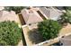 Aerial view of a private backyard, showcasing mature trees, a fenced yard, and ample outdoor living space at 36144 Markree Castle Ave, Dade City, FL 33525