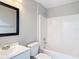 Clean, bright bathroom with vanity and shower-tub combo at 36144 Markree Castle Ave, Dade City, FL 33525