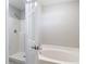 Bathroom featuring a soaking tub, tiled shower, and neutral color scheme at 36144 Markree Castle Ave, Dade City, FL 33525