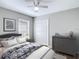 Inviting bedroom features a comfortable bed and neutral tones for a relaxing retreat at 36144 Markree Castle Ave, Dade City, FL 33525