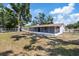 Backyard with enclosed patio at 3622 Tamarix Dr, Tampa, FL 33619