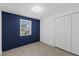 Bright bedroom with modern finishes, wood-look flooring, and natural light from the window at 3622 Tamarix Dr, Tampa, FL 33619
