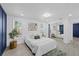 Sunlit bedroom featuring wood-look floors and large closet at 3622 Tamarix Dr, Tampa, FL 33619