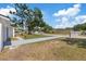 Long driveway leading to a well-maintained home in a quiet residential neighborhood at 3622 Tamarix Dr, Tampa, FL 33619