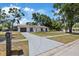 Pleasant residential home with an extended driveway, landscaping, and charming curb appeal at 3622 Tamarix Dr, Tampa, FL 33619