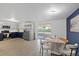 Open-concept kitchen with stainless steel appliances flows into a dining area at 3622 Tamarix Dr, Tampa, FL 33619