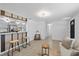 Open concept living area with tile flooring and a seamless transition into the kitchen at 3622 Tamarix Dr, Tampa, FL 33619