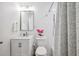 This bathroom features a new vanity, decorative mirror, fresh paint and shower at 3914 W Cleveland St, Tampa, FL 33609