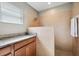 Bathroom features large walk in shower with dual shower heads, wood cabinets, and granite countertop at 3914 W Cleveland St, Tampa, FL 33609
