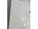 Elegant white marble countertop with subtle veining, complemented by a white basin at 3914 W Cleveland St, Tampa, FL 33609