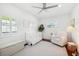 Sun-lit Bedroom with crisp white walls, neutral furnishings, shutters, and decorative pieces at 3914 W Cleveland St, Tampa, FL 33609