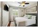 Bedroom features wood floors, a ceiling fan, decor, and lots of natural light at 3914 W Cleveland St, Tampa, FL 33609